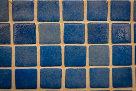 Blue ceramic mosaic on the wall as background.の写真素材