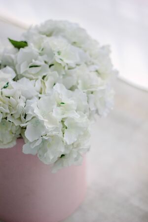White flower bouquet over a tableの写真素材