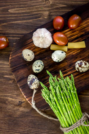 Top view of quail eggs, asparagus and vegetables.の写真素材