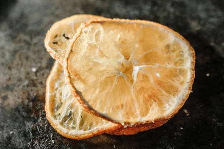 Dried orange over the black metal board.の写真素材