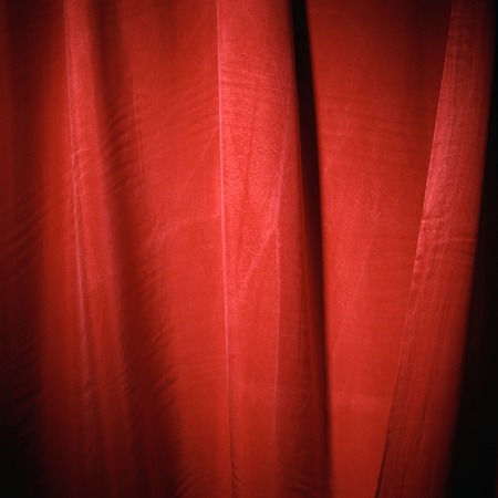 red and maroon shiny cloth curtain material texture backgroundの写真素材