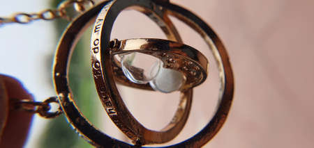 metallic golden hourglass key chainの写真素材