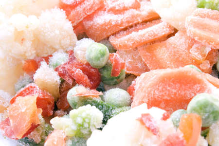 frozen vegetables coated ice crust with little pieces of iceの写真素材