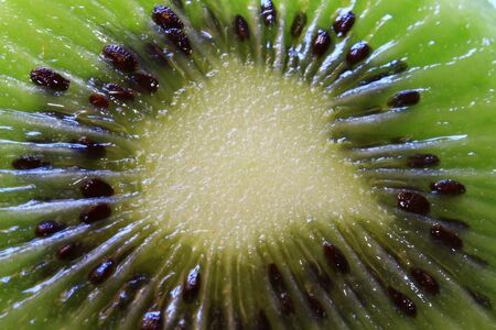 Kiwi Fruit closeup image. Cut green kiwi fruit's macro photoの写真素材