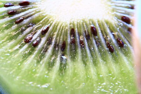 Kiwi Fruit closeup image. Cut green kiwi fruit's macro photoの写真素材