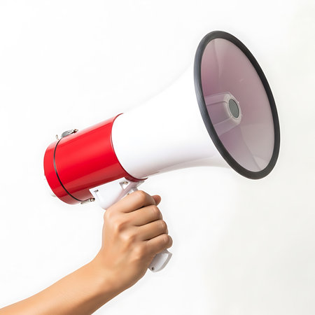 Hand holding megaphone isolated on white background with clipping path.の素材
