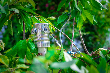 Tin can owl in a garden in Lower Bavaria Germanyの写真素材