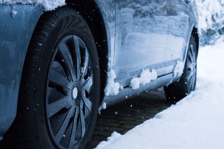 Car an Wheels with Snow and Ice in Winter.