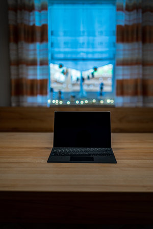 Tablet PC for home office on a wooden desk in Bavaria