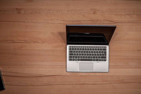 Tablet PC for home office on a wooden deskの写真素材