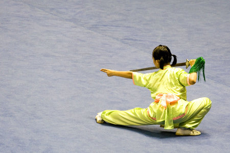 Chinese martial arts exponent in a Wushu competition.
