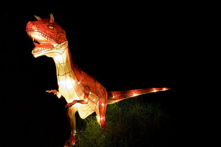 Image of a lighted up dinosaur lanternの写真素材