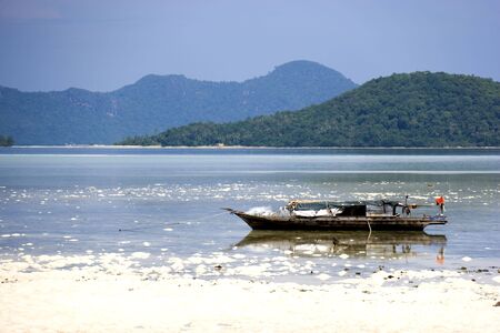 Image of a native fishing boat at low tide.の写真素材