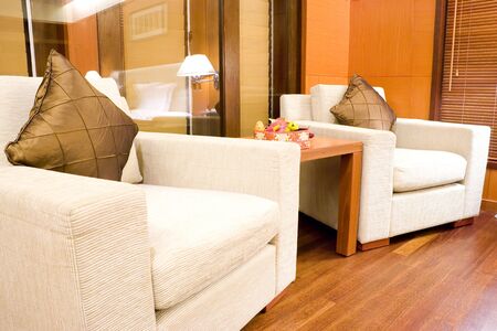 Image of a comfortable looking hotel bedroom sofas.の写真素材