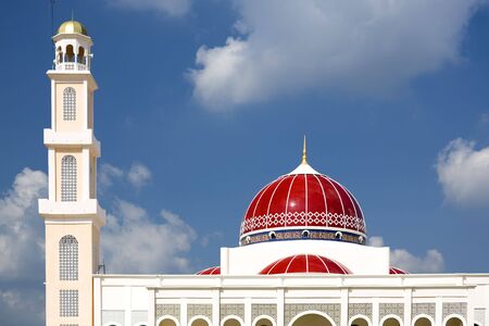A modern red domed mosque in Malaysia.の写真素材
