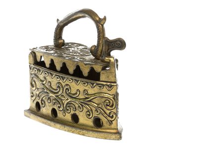 Isolated image of an antique brass iron.の写真素材