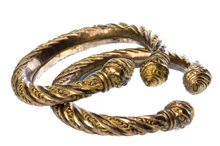 Isolated image of a pair of antique brass ankle bangles.の写真素材