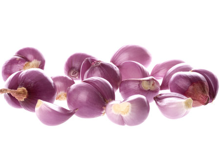 Isolated macro image of peeled small onions.の写真素材