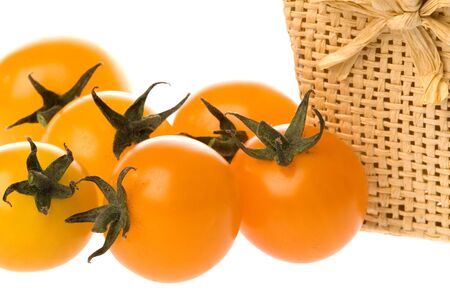 Isolated macro image of cherry tomatoes.の写真素材