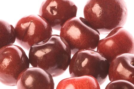 Isolated macro image of fresh cherries.の写真素材