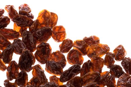 Isolated macro image of dried raisins.の写真素材