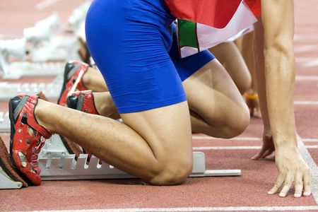 Image of a 100 meters athlete at the starting block.の写真素材