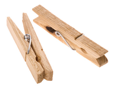 Isolated macro image of wooden laundry pegs.