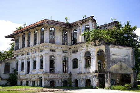 Image of a dilapidated heritage building located at UNESCO's World Heritage site of Georgetown, Penang, Malaysia. It used to be a proud home for one of Georgetown's richest man, subsequently a Chinese school and now unfortunately left to decay.の写真素材
