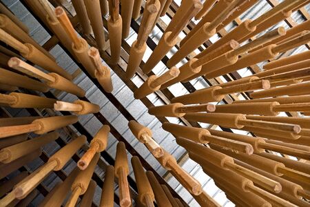 Image of joss sticks being hang dried at a factory in Malaysia.の写真素材