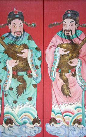 Image of a guardians painted on a chinese temple door in Malaysia.の写真素材