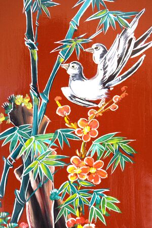 Traditional artwork on a Chinese temple wall in Malaysia.の写真素材