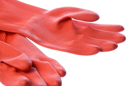 Isolated image of a pair of red rubber gloves.の写真素材