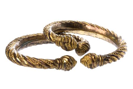 Isolated image of a pair of antique brass ankle bangles.の写真素材