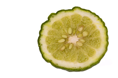 Isolated macro image of a cut Kaffir Lime.