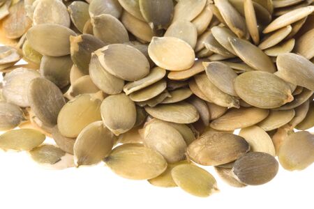 Isolated macro image of pumpkin seeds.の写真素材