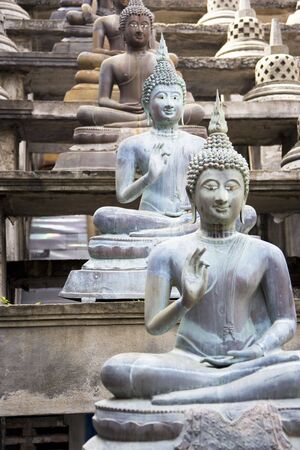Image of Buddha statues at Gangaramaya Temple, Colombo, Sri Lanka.の写真素材
