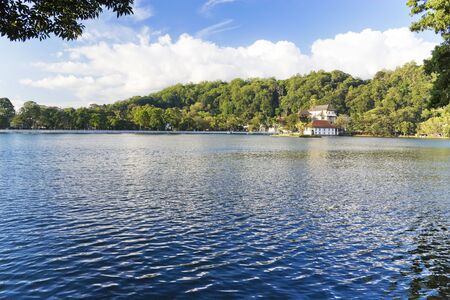 Image of Kandy Lake and the Temple of Tooth together with the Royal Palace, Sri Lanka. These are UNESCO's World Heritage sites. The Temple of the Tooth is the world's most sacred Buddhist site, where lies Buddha's tooth.の写真素材