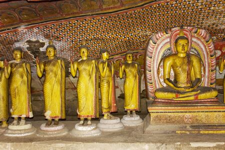 Image of Buddha statues in a cave at the ancient Rock Temple, Dambulla, Sri Lanka. This is a UNESCO World Heritage Site.の写真素材
