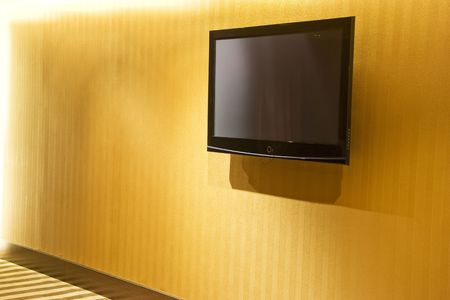 Image of a flat screen television mounted on a wall.の写真素材