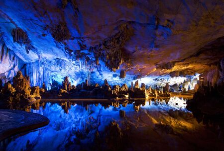 Image of stalactite and stalagmite formations all lighted up at Reed Flute Cave, Guilin, Guangxi Zhuang Autonomous Region, China.の写真素材