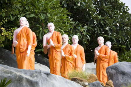 Image of statues of Buddhist monks at UNESCO's World Heritage site, the Golden Temple at Dambulla, Sri Lanka. の写真素材