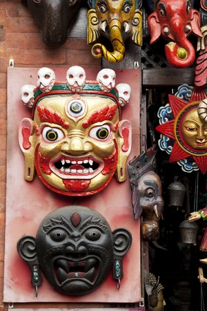 Image of wooden masks in traditional Nepalese style for sale at UNESCO's world heritage site of Swayambunath Temple, Kathmandu, Nepal.の写真素材
