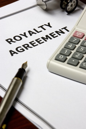 Image of a royalty agreement on an office table.の写真素材