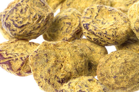 Isolated macro image of preserved liquoriiced plums.の写真素材