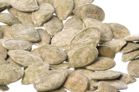 Isolated macro image of green tea pumpkin seeds.の写真素材
