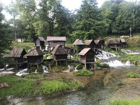Bosnia's enchanting Jajce Waterfall: Nature's masterpiece in a serene setting, Bosniaの写真素材