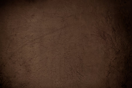 dark grunge scratched leather to use as backgroundの写真素材