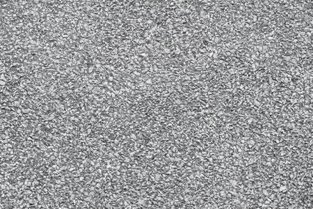 Close-Up of Asphalt Pavement with Rubble - Top View Backgroundの写真素材