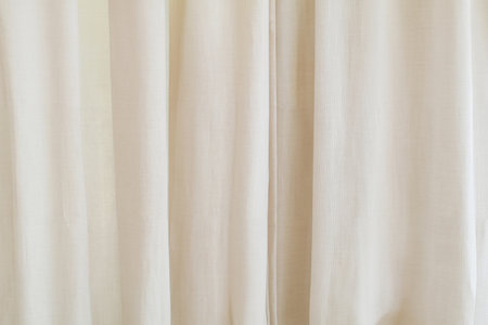Elegant Cream Satin Curtain Fabric Texture for Event Backdropの写真素材