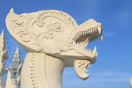 White half lion and dragon head sculpture on blue sky backgroundの写真素材